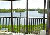Central Gulf Coast Condominium rental - Interior Photo - Relax & enjoy this beautiful view of the bay from the lanai