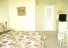 Central Gulf Coast House rental - Interior Photo - Enjoy our master bedroom with private bathroom and TV