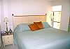 Siesta Key Condominium rental - Interior Photo - Master bedroom features a king bed, a tv set, & private bathroom
