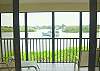 Central Gulf Coast Condominium rental - Interior Photo - Relax on our outside lanai and watch boats glide along the bay
