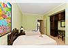 A spacious bedroom with 2 twin size beds