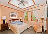Beautiful guest bedroom with cozy queen size bed