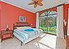A beautiful view of master bedroom with a cozy king size bed