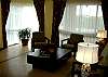 Nice Living Room with a custom made table and one sofa and 2 chairs