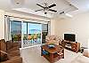Spaious living room with cozy sofas and ocean view