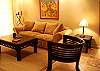Nice living area with comfortable sofa and finest wood furniture