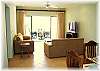 Living room with cozy sofas and LCD TV