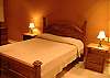Bedroom with full size bed and nuce lace table lamps