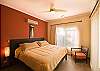 Spacious and comfortable master bedroom with king size bed