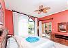 Spacious master bedroom with a king size bed