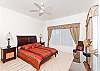 Master bedroom with cozy queen size bed and finest furniture.