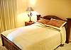 A nice cozy queen size bed