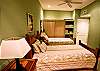 A beautiful and spacious bedroom with 2 tiwn size beds
