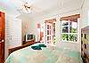 Spacious guest bedroom with comfortable queen size bed