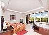 A spacious and beautiful master bedroom with jacuzzi tub
