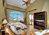 Spacious bedroom with cozy sofas and LCD TV