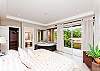 A beautiful spacious master bedroom with a king size bed