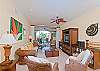 A beautiful view of spacious living room with cozy sofas and television