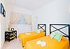 A nice view of bedroom with beautiful 2 twin size beds