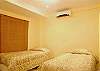 Comfortable twin size beds in spacious bedroom