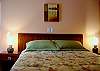Comfortable queen size bed in guest bedroom