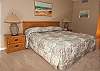 Nicely decorated oceanfront guest bedroom with a king size and private bathroom.
