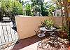 Covered front door entrance w/Private gated courtyard. - South Forest Beach Condominium with Two Private Courtyards. This front entrance is perfect for parking your beach caddy, bikes and rafts.