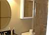 Newly rennovated bathroom w/granite vanity top and tiled shower stall...