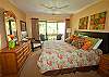 Nicely decorated master bedroom w/and king size bed and private balcony.