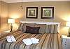 Nicely furnished bedroom w/a king size bed...