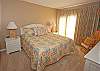 Nicely decorated oceanfront master bedroom w/a king size bed and private bathroom.