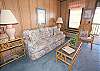 Living room w/a queen size sofa sleeper.  Balcony of living room offers spectacular view of ocean.