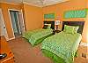 Nicely decorated guest bedroom w/two twin size beds.