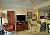 Nicely decorated living room offers a flat screen tv...internet access