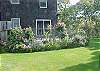 Large Backyard with Deck and Flower Gardens