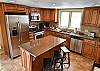 Newly remodeled, fully equipped kitchen with an open dining room area. 