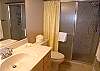 Master bathroom with large tile shower.