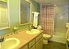 Nicely updated guest bath with double vanity and tub/shower.