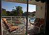 Balcony with comfortable chairs and a beautiful view of the pool & spa.