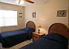 Twin beds in the second bedroom.