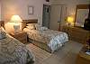 Versatile second bedroom has a bridge and bedding to convert the twin beds to a king size. There is a cable TV too!