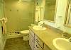 Updated master bathroom with double vanity & tile shower.