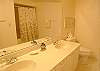 Master bath with double vanity and large tub/shower.