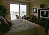 Master Bedrom with sliding doors to the bayfront balcony.