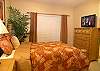 Guest bedroom with queen bed & 32 inch LCD TV.