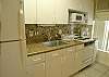 Kitchen with glass tile backsplash