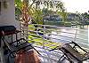 Balcony with super-comfortable chairs, electric BBQ and views of the pond & fountain.  A great spot for bird watching!