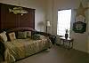 High-riser trundle bed can be used as two twin beds or made up as a king.  This bedroom also has a large closet and adjoining bath with tub/shower.