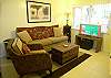 Living area with flatscreen cable TV/DVD.