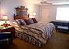 Third bedroom with king size bed, adjacent full bath and entrance to bay side balcony.